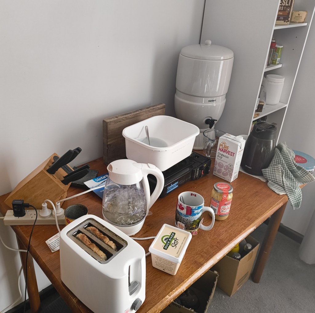 An image of an ad hoc kitchen that also doubles as a great OH&S what not to do image.