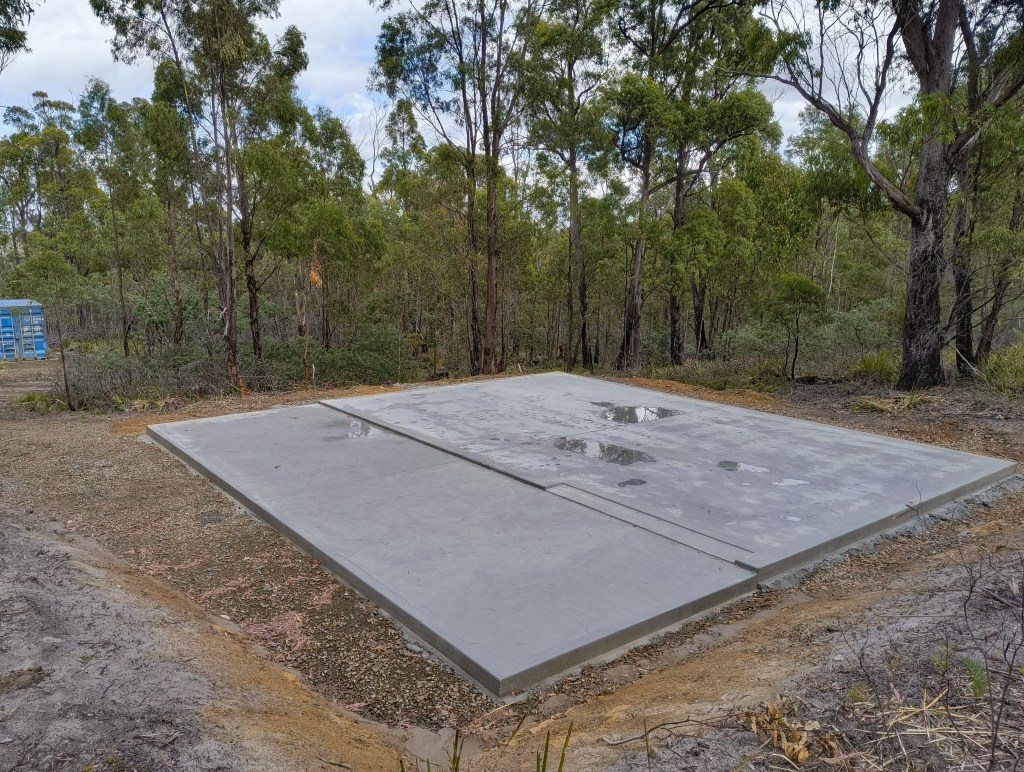 An image of a concrete slab in the bush.